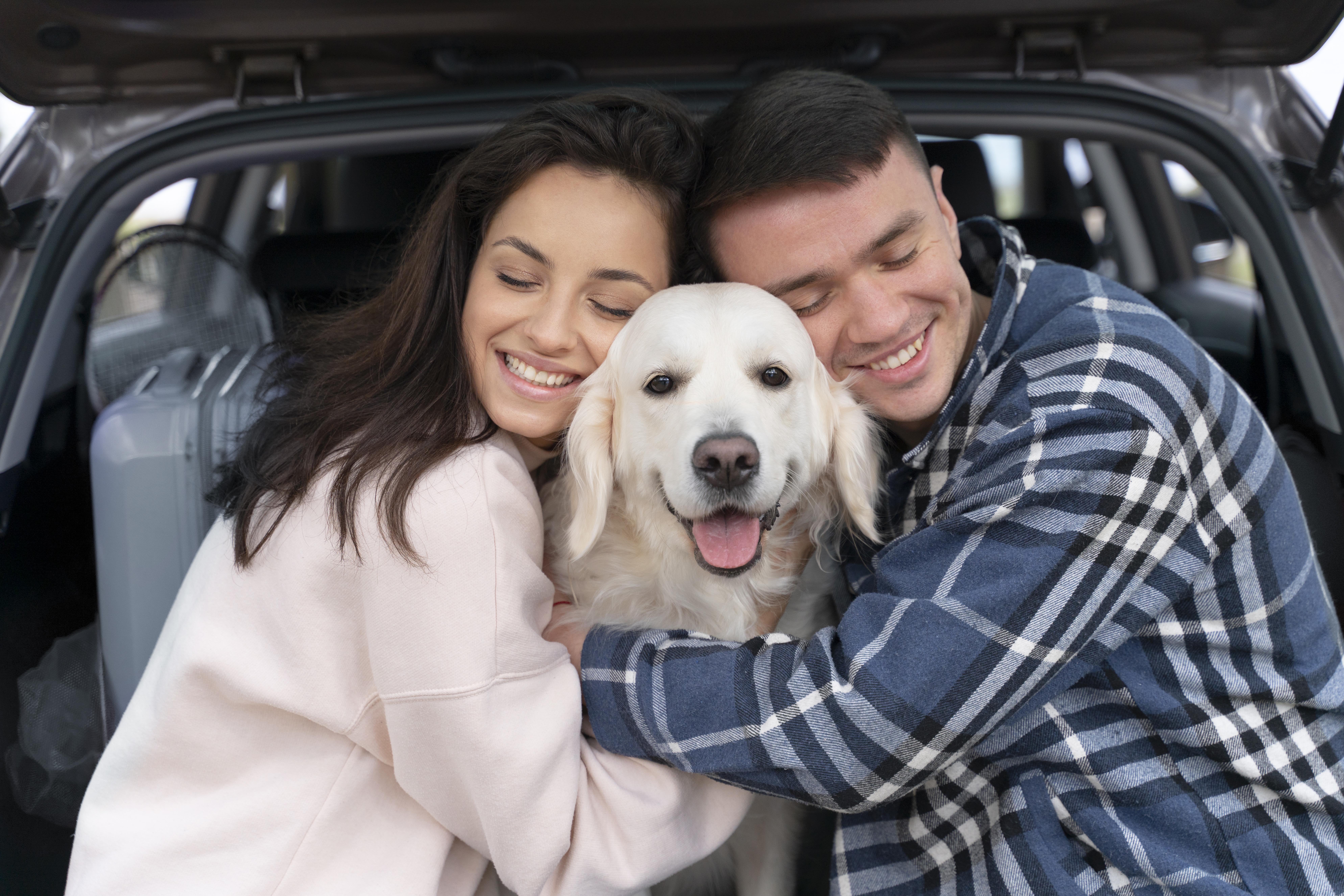 smiley-people-hugging-dog-medium-shot